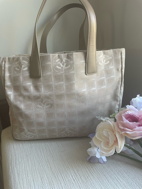 CHANEL Handbags - CHANEL Cream Jacquard Tote with Signature Motif